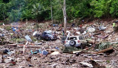 This photo taken on 30 September, 2009 shows rescuers working through the rubble from the devastation caused when the tsunami hit the south coast of Samoa. Photo: Paul Anderson / AFP