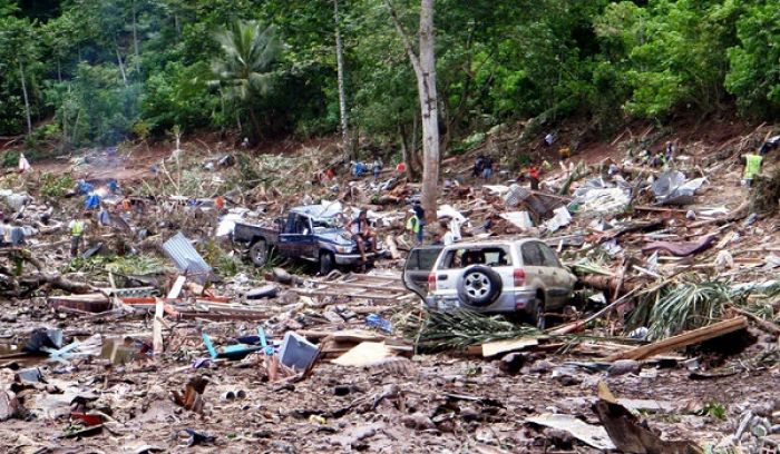 This photo taken on 30 September, 2009 shows rescuers working through the rubble from the devastation caused when the tsunami hit the south coast of Samoa. Photo: Paul Anderson / AFP