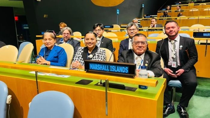 Marshall Islands Ambassador to the United Nations John Silk, seated at right with members of the Marshall Islands delegation, in the General Assembly hall in New York last October following the country's election to the UN Human Rights Council.