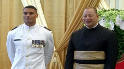 Warrant Officer Seaman Combat Specialist Mark Latu with King Tupou VI during the Tongan ruler’s recent 60th birthday celebrations. Photo: NZDF